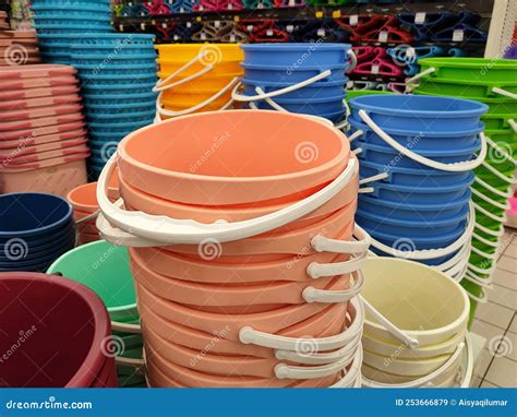 Several Plastic Buckets Of Various Colors And Sizes Are Displayed For
