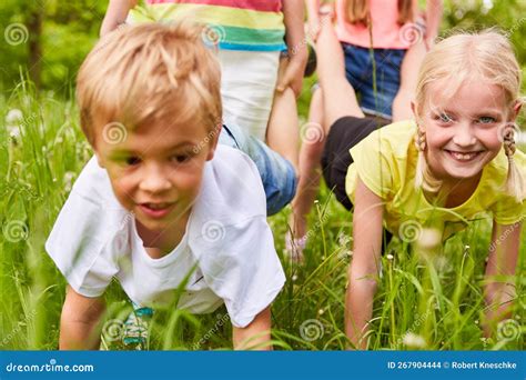 Group of Kids Playing Wheelbarrow Race Competition Stock Photo - Image of friends, happy: 267904444