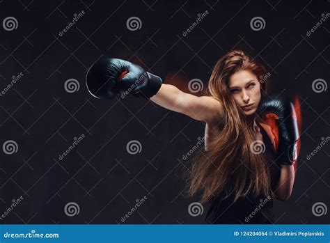 Beautiful Brunette Female Boxer During Boxing Exercises Focused On A