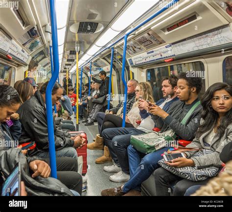 London Underground Tube Train Passengers Commuters Sitting Inside