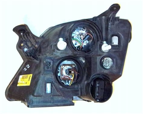 LAMPA PRZEDNIA PRAWA REFLEKTOR OPEL MERIVA I A 7702032893 Oficjalne