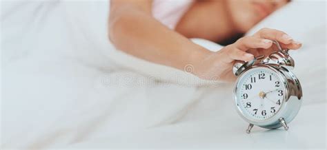 Sleepy Woman Yawning And Stretching On Her Bed After Waking Up Indoors