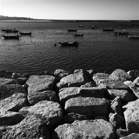 Premium Photo View Of Boats In Calm Sea