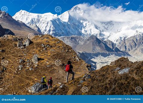 Happy Trekkers Hiking In Mountains Of Nepal Editorial Stock Photo