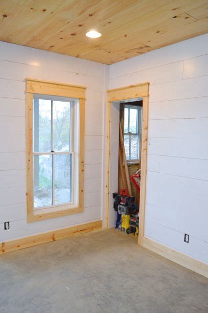 Installing Diy Shiplap Walls And Farmhouse Trim From Wood Flooring Shiplap Wall Diy Farmhouse