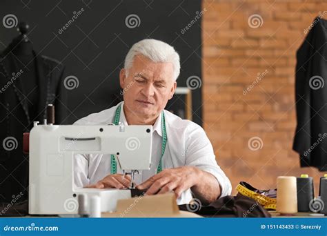 Mature Tailor Working On Sewing Machine In Atelier Stock Image Image