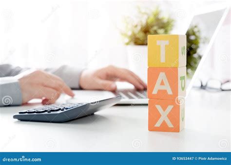 Accountant Calculates Tax Working In The Office With Calculator Stock