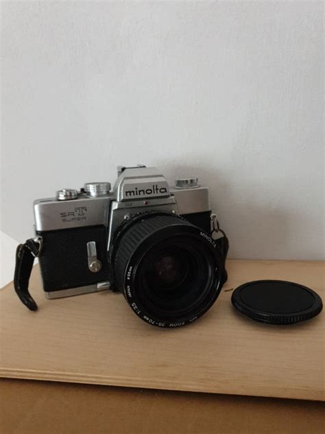 MINOLTA SRT + Lens, Photography, Cameras on Carousell