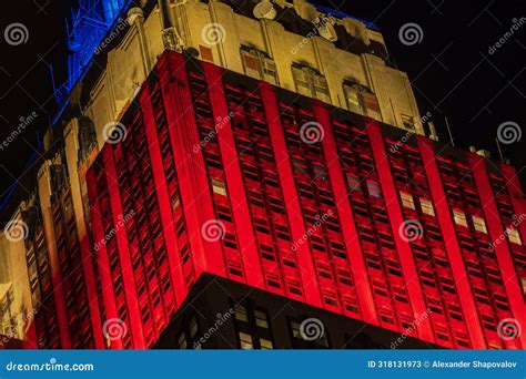 Beautiful Night View Of The Building Illuminated In Vibrant Red Yellow