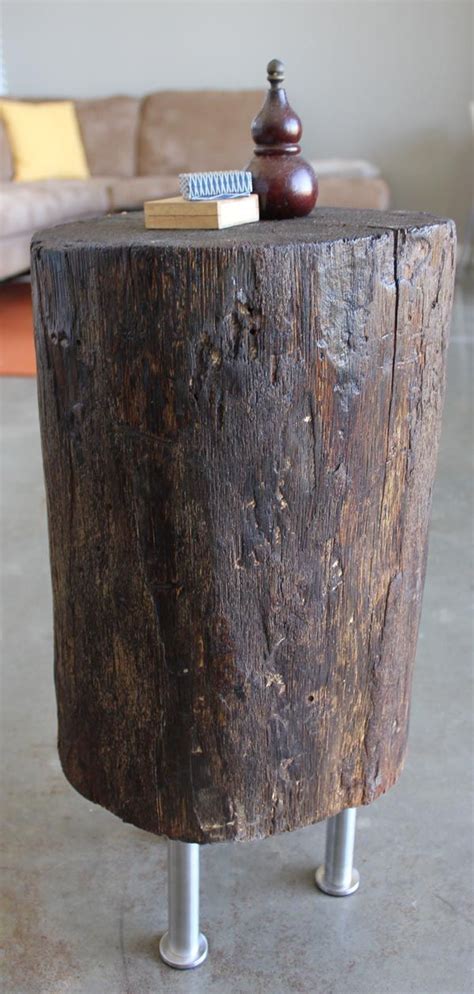 A Tree Stump Becomes A Side Table With A Couple Of Legs Some Stain