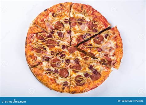 Cut into Pieces of Pizza with Tomato, Olives, Sausage and Cheese on a Wooden Platter Stock Photo ...