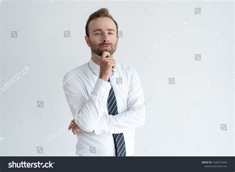 Sneaky Business Man Touching Chin Thinking Stock Photo 1098157040