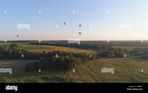 Aerial View Hot Air Balloons In Sky Over Fields In Countryside Beautiful Sky And Sunset