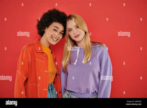 Cultural Diversity Happy Multicultural Women Looking At Camera On Coral Background Blonde And