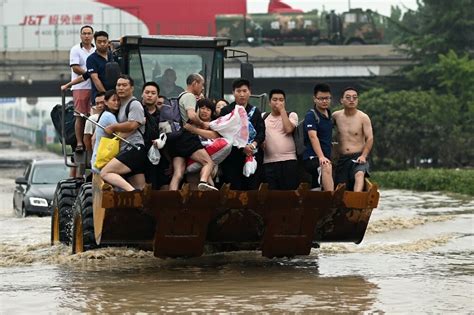 Villagers Flee Fresh Floods In Central China As Typhoon Approaches