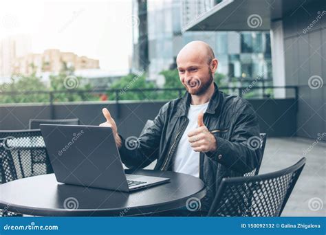 Smiling Attractive Adult Successful Bald Bearded Man In Black Jacket