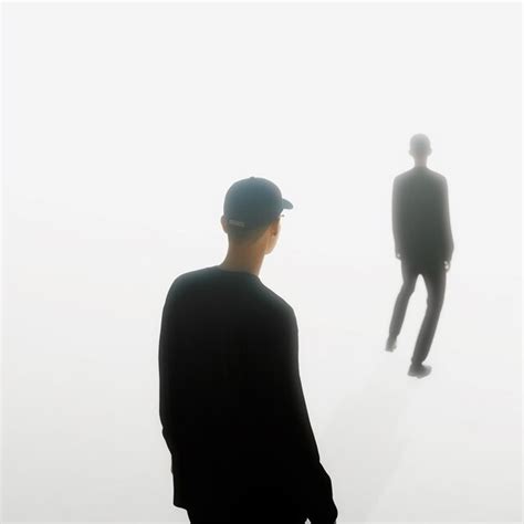 Premium AI Image | a man is standing in the fog with a man in a hat.