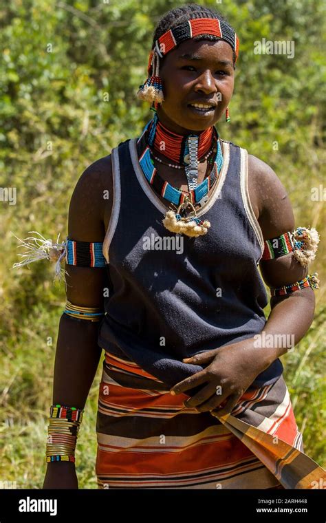 Young Hamer Woman With Traditional Clothings And Hairstyle Hamer Tribe