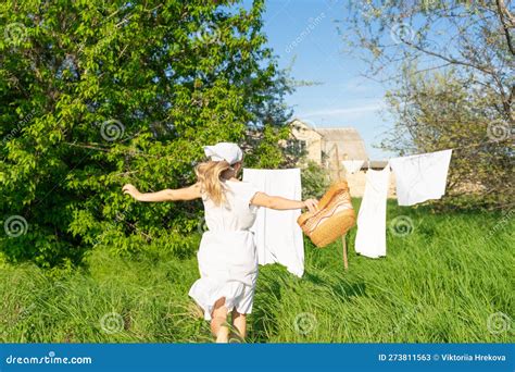 Young Woman Hanging Laundry Outdoors Beautiful Girl Working In