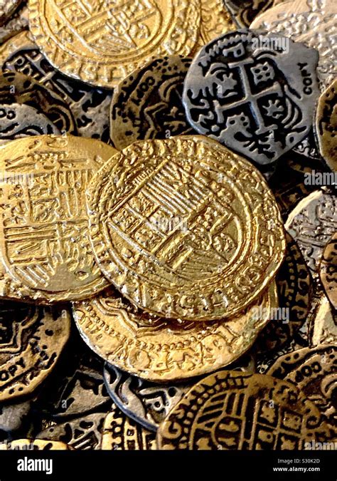 Replica antique coins Doubloons pieces of eight Stock Photo - Alamy