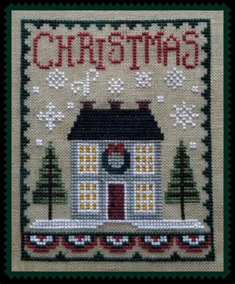 A Cross Stitch Christmas Card With A House