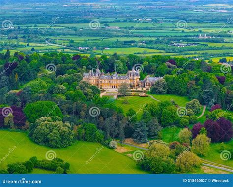 Aerial View Of Waddesdon Manor Atop A Hill Surrounded By Lush Green