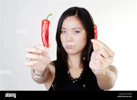 Picture Of Lovely Woman With A Hot Fresh Chilli Stock Photo Alamy