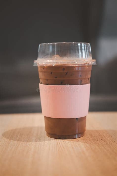 Iced Mocha Coffee In Take Away Cup With Pink Paper Sleeve Stock Image