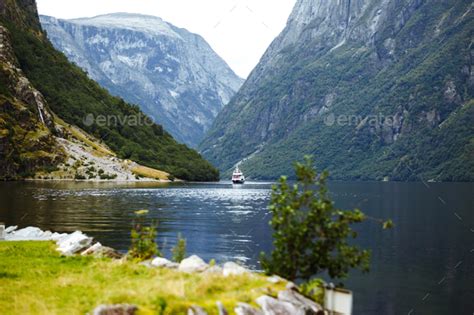 Ship Sailing In Norwegian Fjords Nature View With Fjord And Mountains