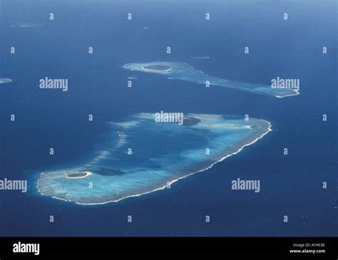 Aerial view of coral reefs and atoll islands Stock Photo - Alamy