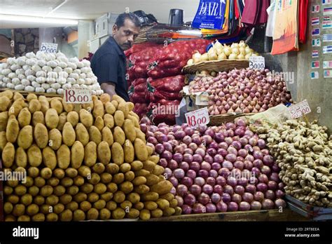 Vendor Behind His Market Stall At The Central Market In Port Louis