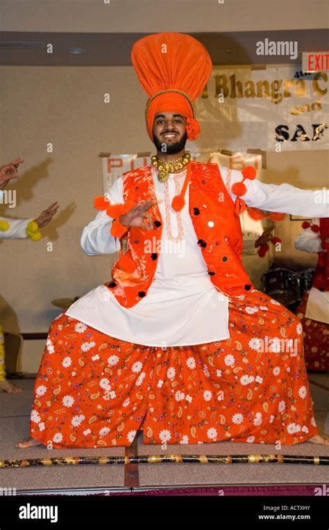 A SOLO BHANGRA DANCER IN ORANGE DRESS Stock Photo - Alamy