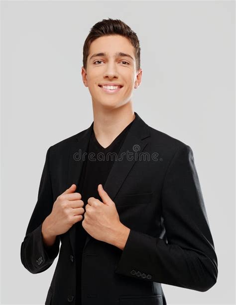 Portrait Of Smiling Handsome Teenage Boy In Elegant Clothes Studio