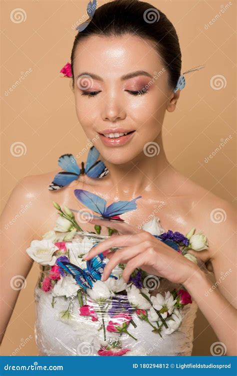 Beautiful Happy Naked Asian Girl In Flowers With Butterflies On Hand