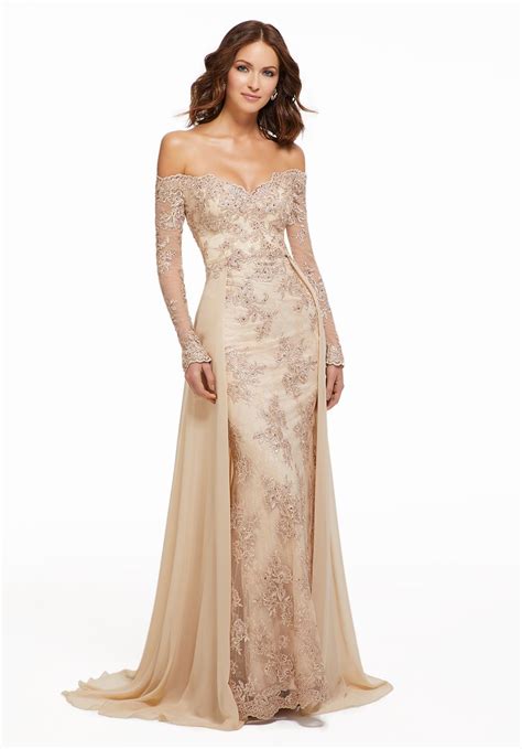 This MGNY By Mori Lee 72033 Champagne Formal Gown Is Styled In Floral