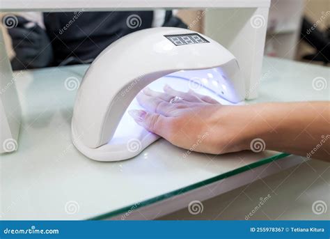 Female Hand With Manicured Nails Inside A Uv Lamp Stock Image Image