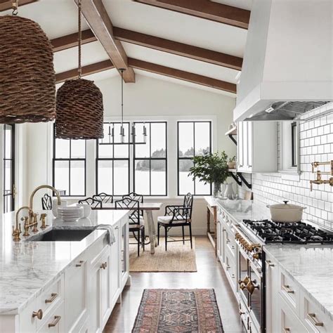 A Timeless Kitchen Updated With Brass Hardware And Basket Lighting