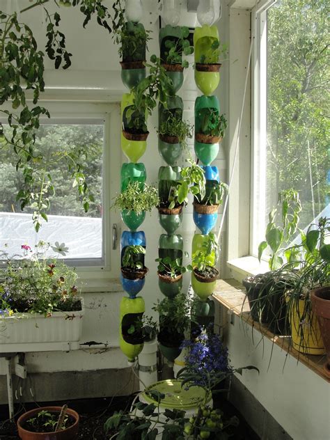 Colorful Vertical Garden Made Out Of Recycled Soda Bottles Uses An