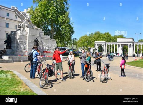 Tour Guide Pointing Conducted Guided Tour For Group Of Men And Women