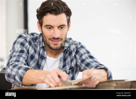 Man Cuts A Box With A Stationery Knife Stock Photo Alamy