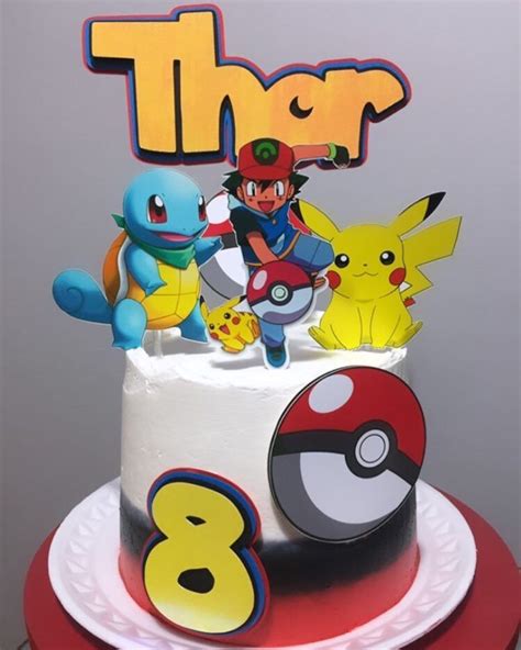 A Birthday Cake Decorated With Pokemon Characters And The Word Thr On Top