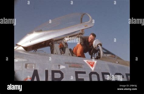 1950s Pilot Climbs Into Cockpit Of Air Force Fighter Jet Pilot Dons