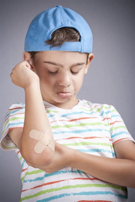 Injured Boy With A A Bruised Elbow Reacts In Pain Stock Image Image