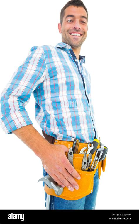 Portrait Of Smiling Handyman Wearing Tool Belt Stock Photo Alamy