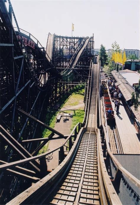 An Overhead View Of A Roller Coaster At A Theme Park