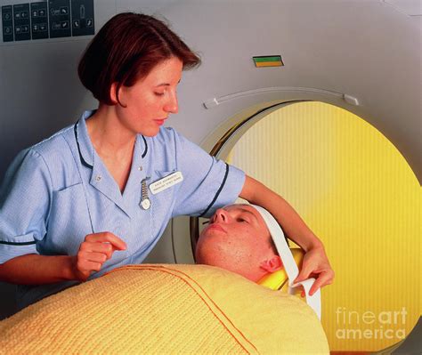 Radiologist Prepares Patient For A Ct Brain Scan Photograph By Simon