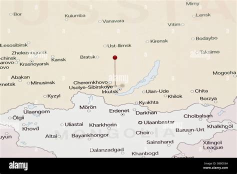 macro photo red pin needle usolye sibirskoye city russia political map stock photo