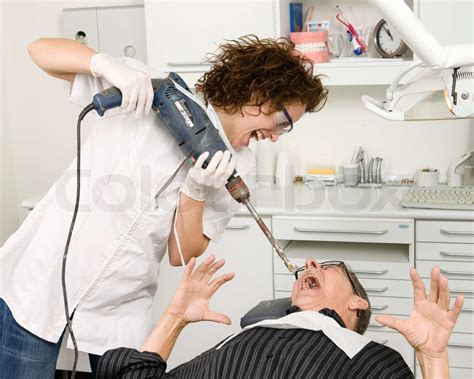 A Crazy Female Dentist With A Power Drill Stock Image Colourbox