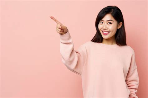 Premium Ai Image Smiling Asian Brunette Woman In Sunglasses Pointing