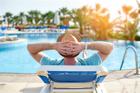 Relax by the pool. stock image. Image of sunbathing, outdoors - 43181623